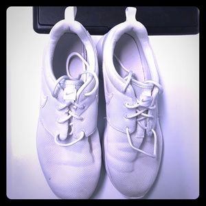 All white NIKE sneakers